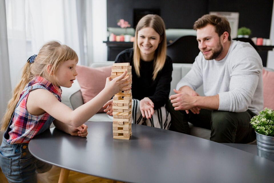 [fpdl.in]_parents-looking-at-daughter-removing-blocks_23-2147800150_large.jpg